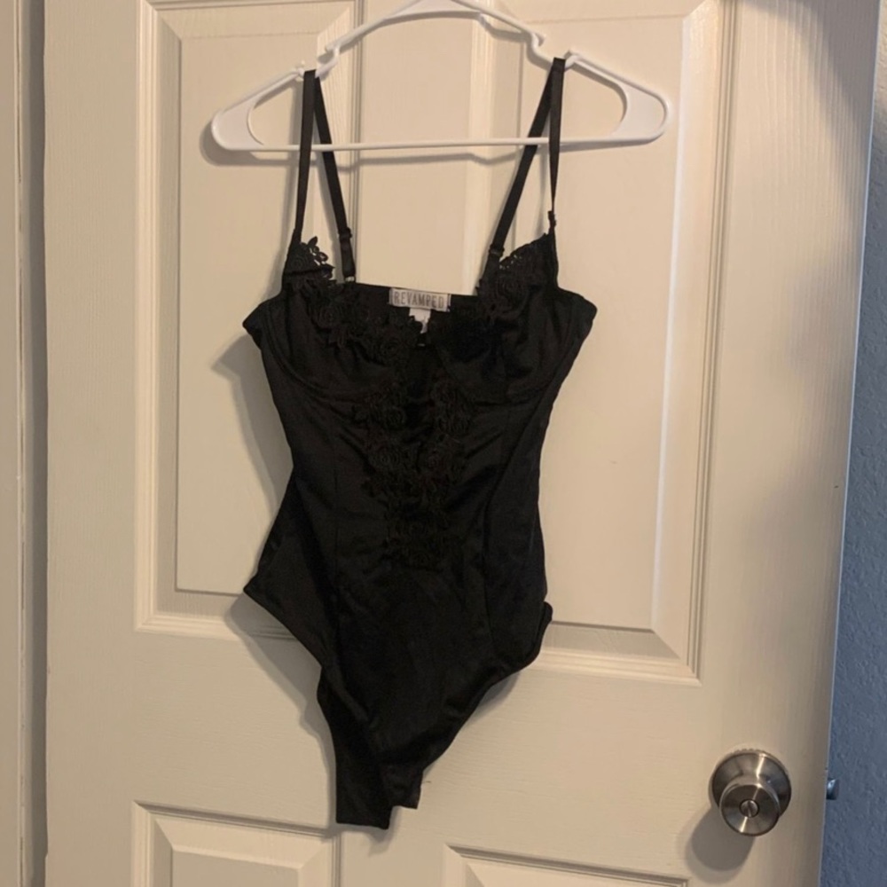 Black body suit with floral print on front